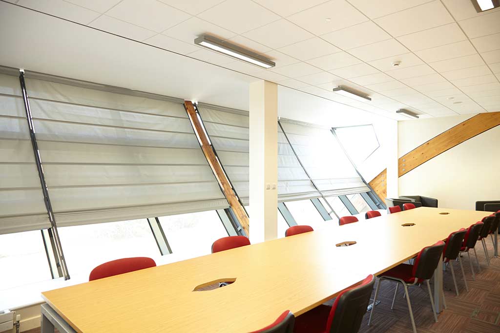 Sloping skylight blinds in meeting room