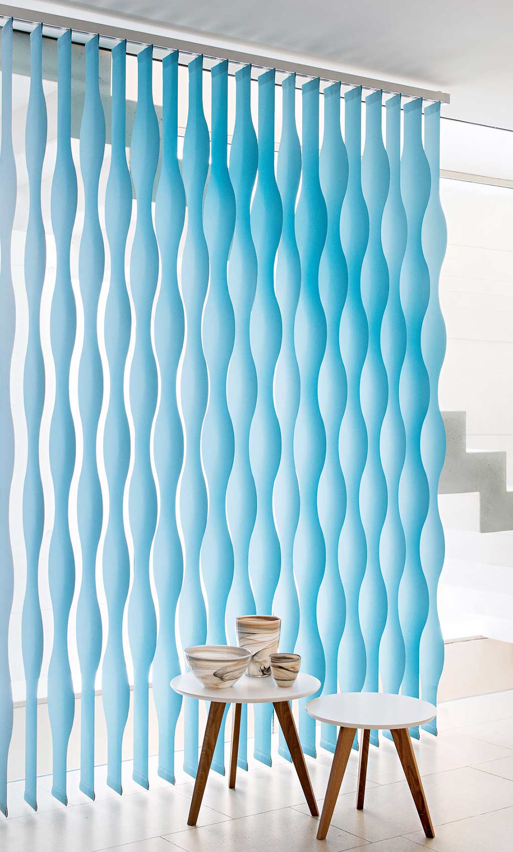 Light blue vertical wave blinds