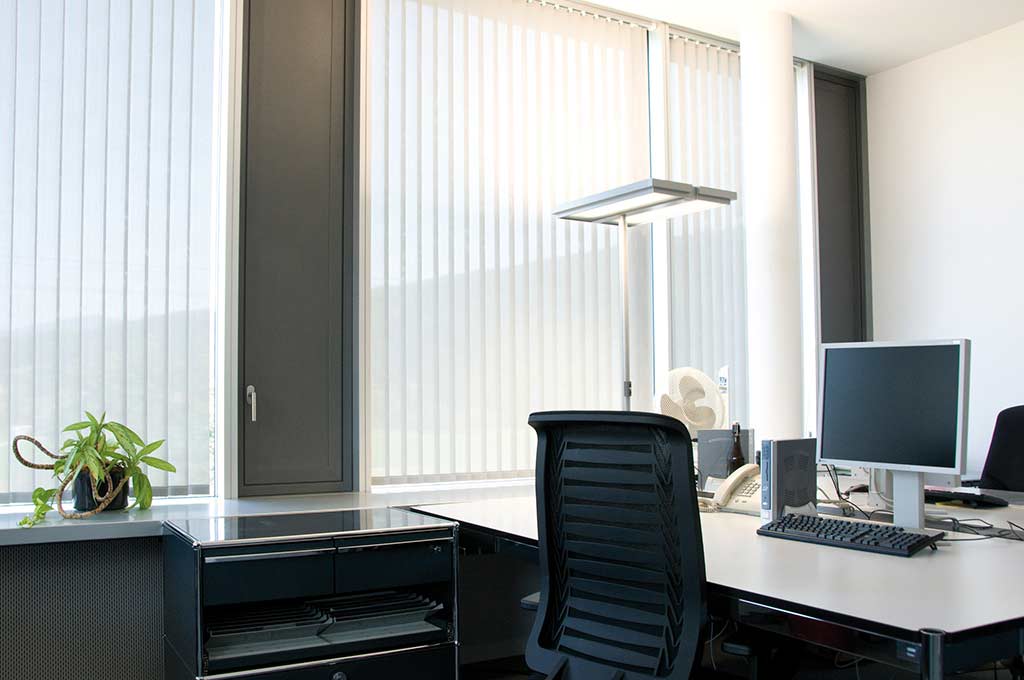 White vertical blinds in an office environment